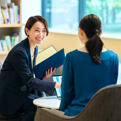 Two business professionals discussing consultancy strategies for Korean IT software expansion in ASEAN markets